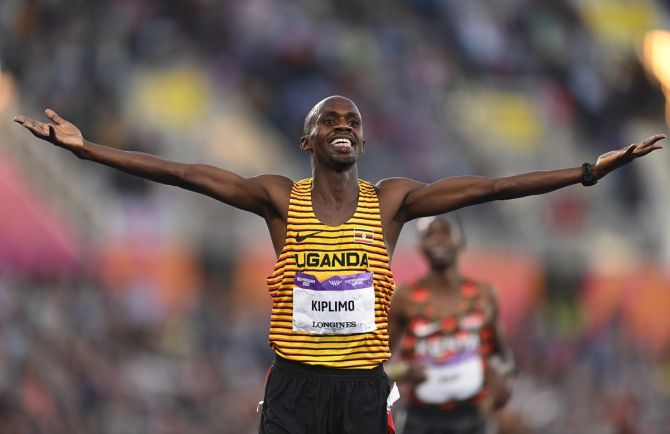 Uganda's Jacob Kiplimo celebrates winning the men's 5000 metres.