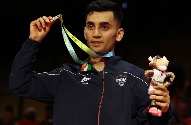 Lakshya Sen celebrates on the podium with his gold medal after beating Malaysia’s Tze Yong NG in the Commonwealth Games' men's singles badminton final