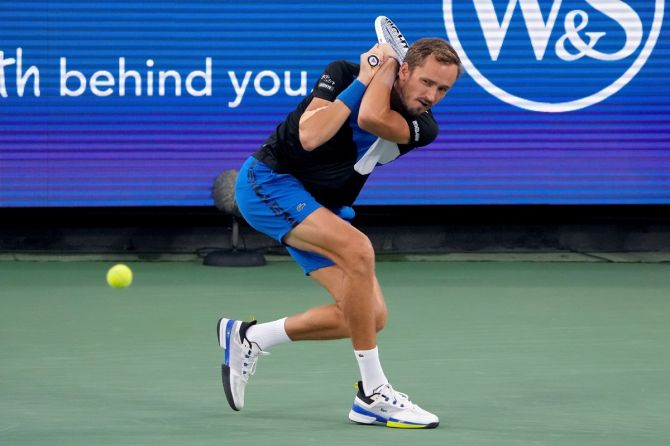 Daniil Medvedev makes a two-handed backhand return during the semi-final 