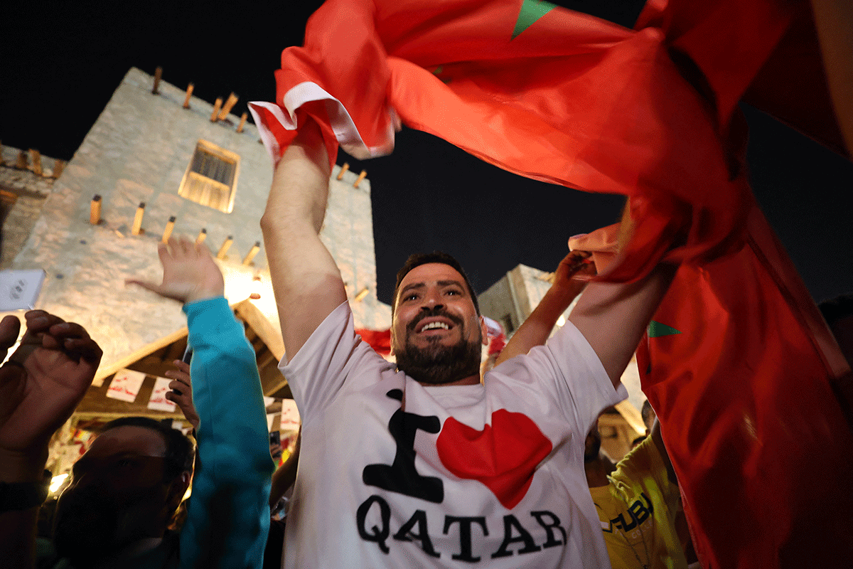 Morocco fans celebrate in Souq Waqif after the Canada v Morocco match as Morocco qualify for the knockout stages