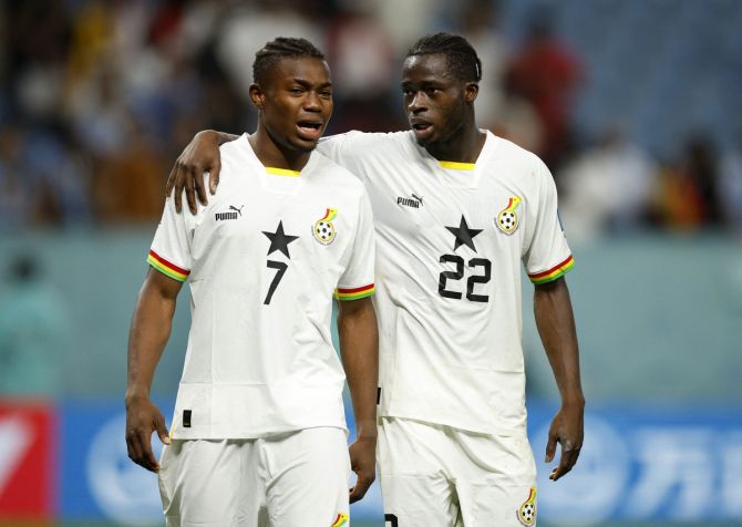 Ghana's Fatawu Issahaku and Kamaldeen Sulemana look dejected after being eliminated from the World Cup