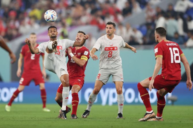 Djibril Sow of Switzerland controls the ball against Dusan Tadic of Serbia during the FIFA World Cup Qatar 2022 Group G match between Serbia and Switzerland