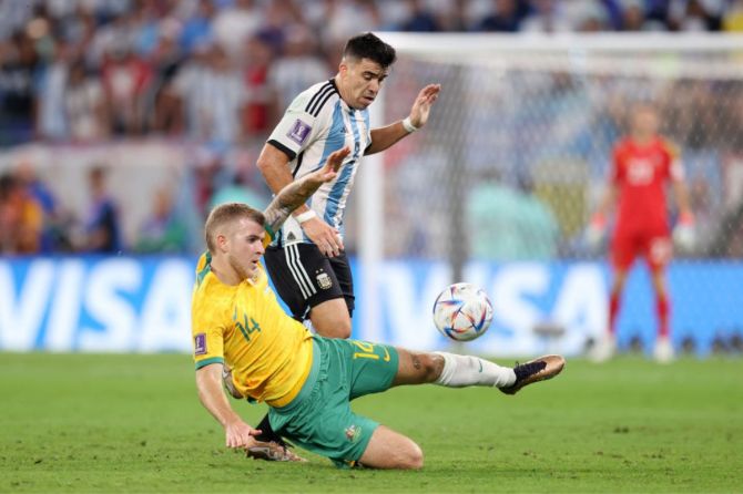 Marcos Acuna of Argentina battles for possession with Riley McGree of Australia