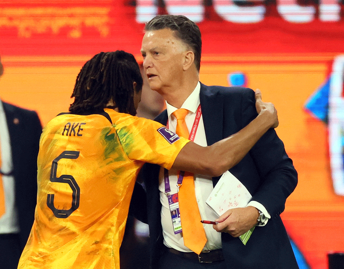 Netherlands' Nathan Ake with coach Louis van Gaal as he is substituted off during the FIFA World Cup last 16 match on Saturday 