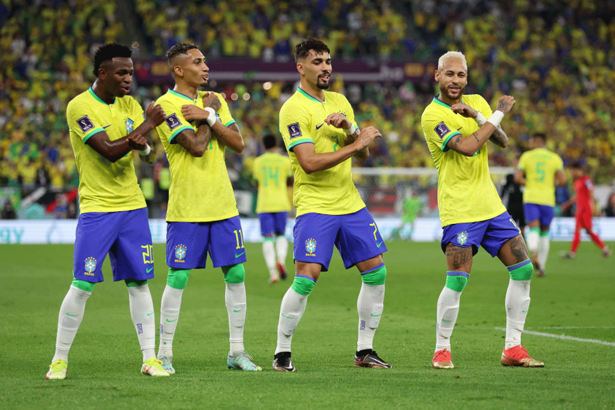 Brazil's Neymar celebrates with Raphinha, Lucas Paqueta and Vinicius Junior after scoring the team's second goal via a penalty