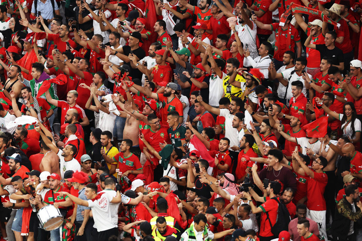 Morocco fans celebrate after the penalty shootout win