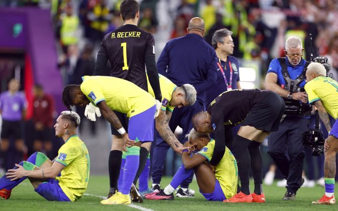 Brazil's players Rodrygo and teammates are distraught after being eliminated from the World Cup.