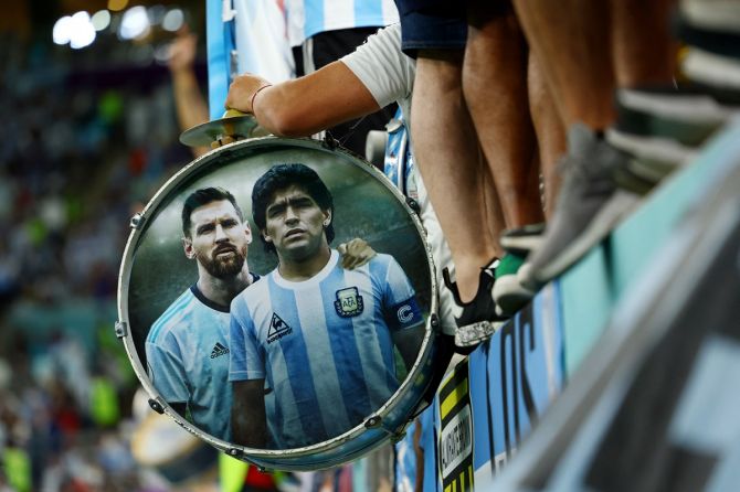 Lionel Messi and Diego Maradona are pictured on a fan's drum during the World Cup match between the Netherlands and Argentina at Lusail Stadium in Doha, Qatar, on Friday.