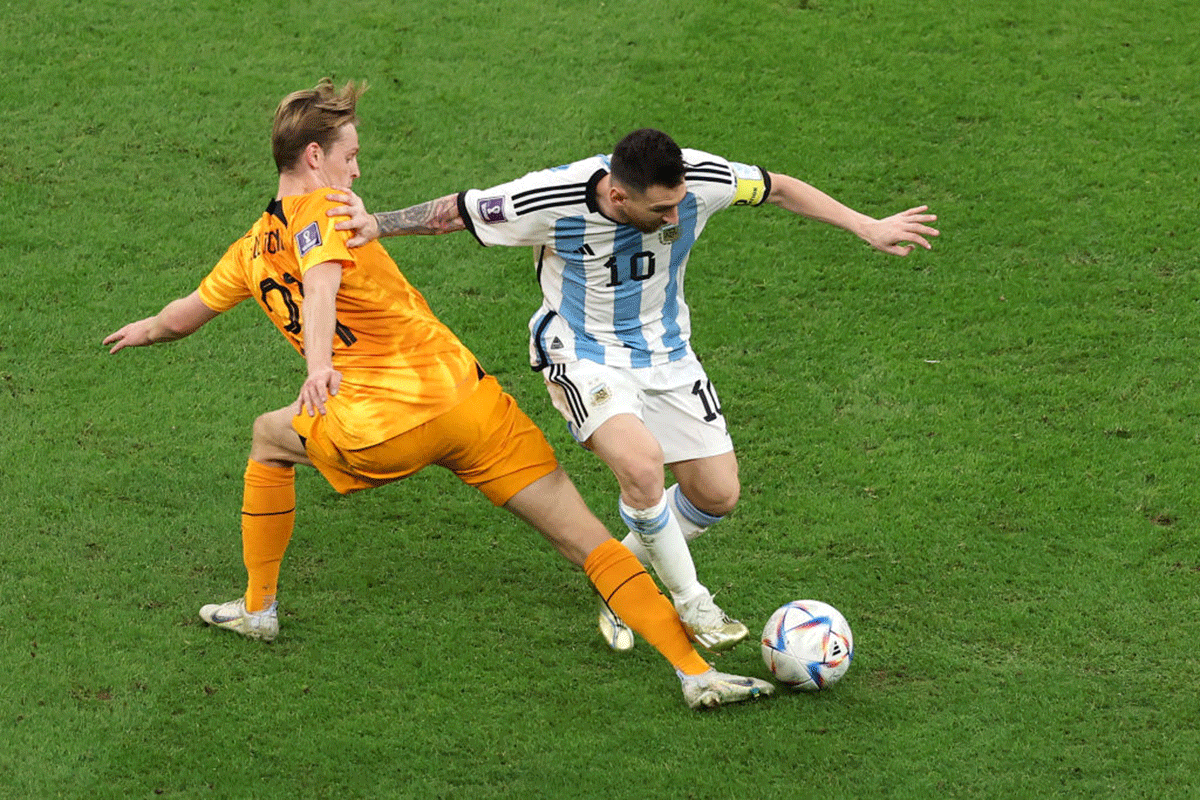 Lionel Messi is challenged by Frenkie de Jong