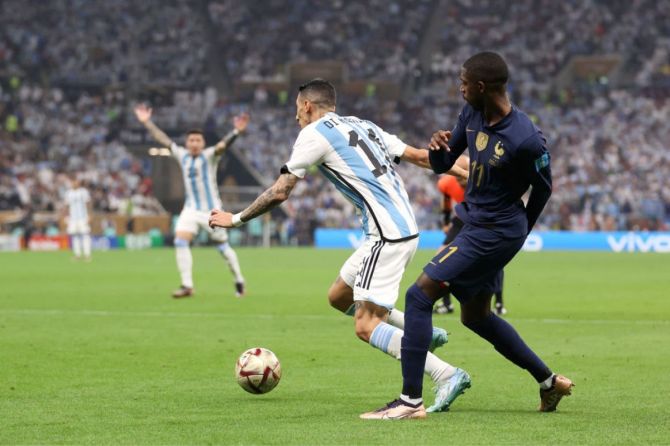 Argentina's Angel Di Maria is fouled by France's Ousmane Dembele leading to a penalty to Argentina