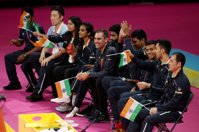 Players and coaches of Team India show their support from the sidelines