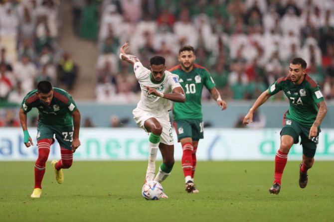Saudi Arabia's Mohamed Kanno controls the ball