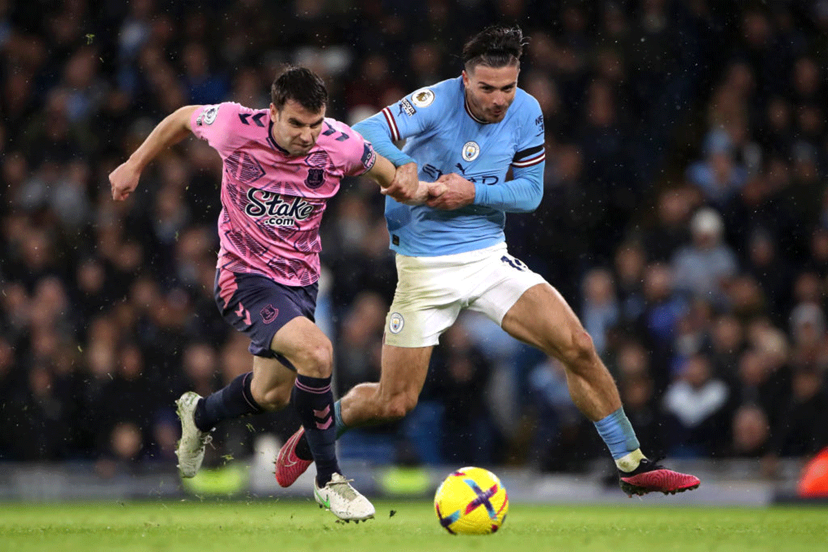 Everton's Seamus Coleman battles for possession with Manchester City's Jack Grealish.