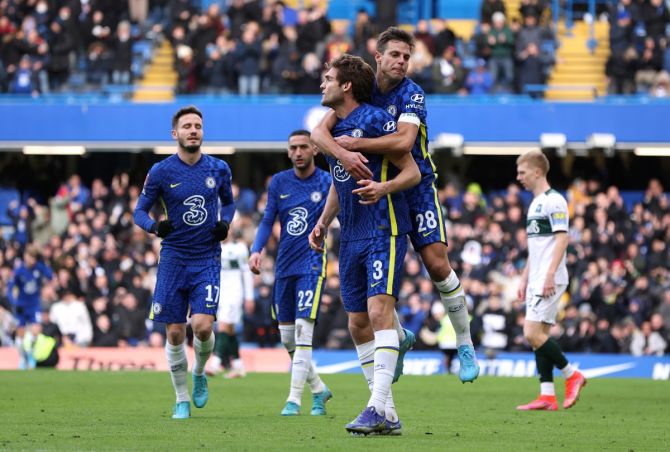 Marcos Alonso celebrates with Cesar Azpilicueta after scoring Chelsea's second goal against Plymouth Argyle in the FA Cup  fourth round at Stamford Bridge, London, on Saturday.