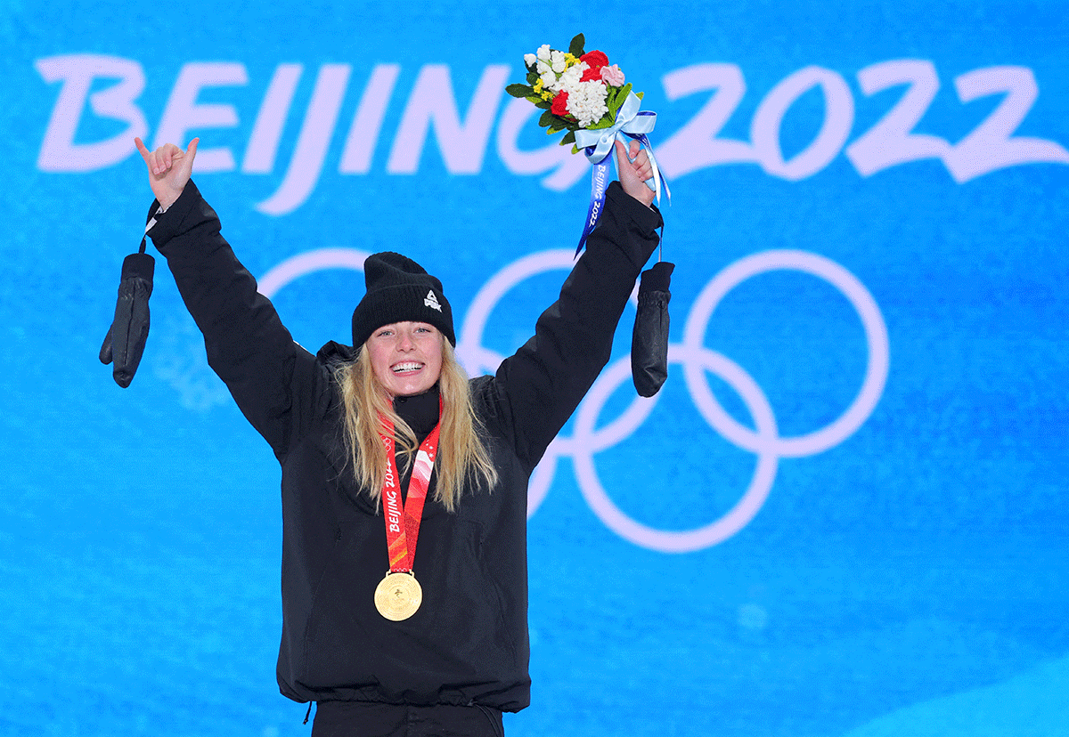 Gold medalist Zoi Sadowski Synnott of New Zealand celebrates on the podium during the victory ceremony after winning gold in the Snowboard W Snowboard Slopestyle event at  Zhangjiakou Medals Plaza, Beijing