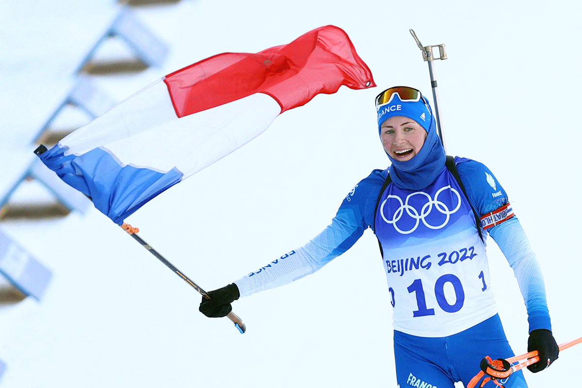 Justine Braisaz-bouchet of France celebrates winning gold in the  Biathlon Women's 12.5km Mass Start at the National Biathlon Centre in Zhangjiakou on Friday