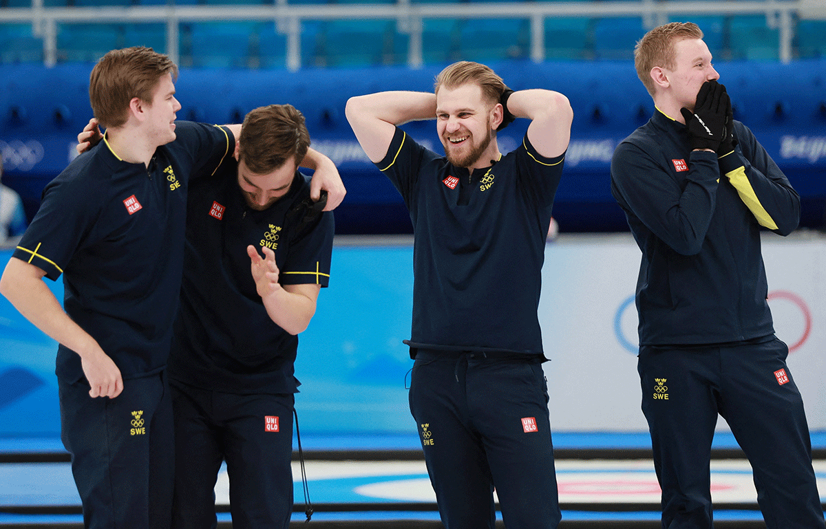 Sweden's Christoffer Sundgren, Vice Oskar Eriksson, Rasmus Wranaa and Daniel Magnusson react after winning the curling men's gold medal game against Britain at National Aquatics Center in Beijing. 