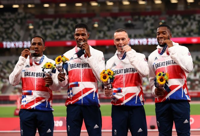 Britain's silver medallists Chijindu Ujah, Zharnel Hughes, Richard Kilty and Nethaneel Mitchell-Blake pose on the podium with their medals from the men's 4 x 100m relay at Olympic stadium, Tokyo, Japan, on August 7, 2021. 