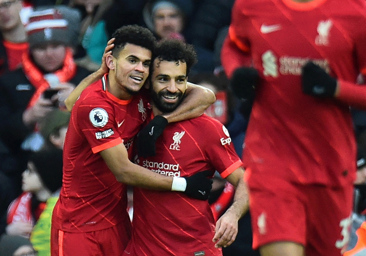 Liverpool's Luis Diaz celebrates with Mohamed Salah on scoring their third goal against Norwich City at Anfield 