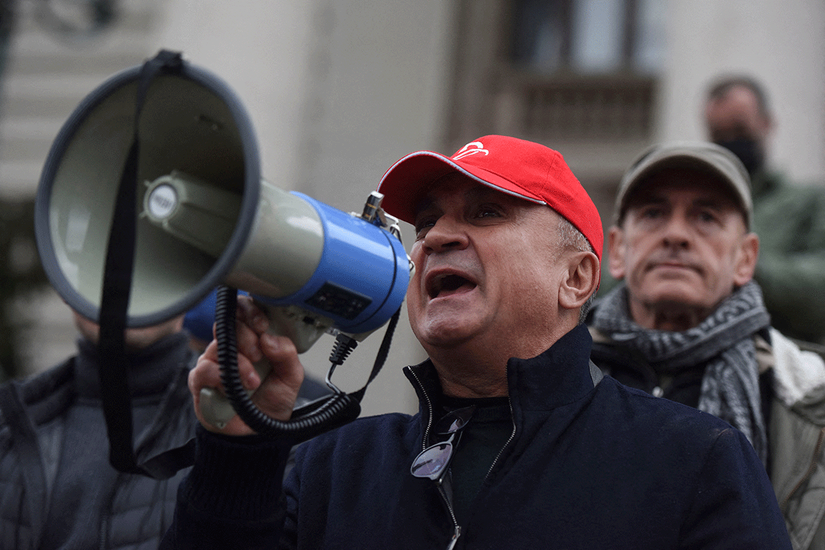Serbian tennis player Novak Djokovic's father Srdjan speaks speaks through a megaphone during the protest in front of the National Assembly in Belgrade, Serbia, as the player is fighting in Australia his visa cancellation and pending deportation in a Federal Court challenge  