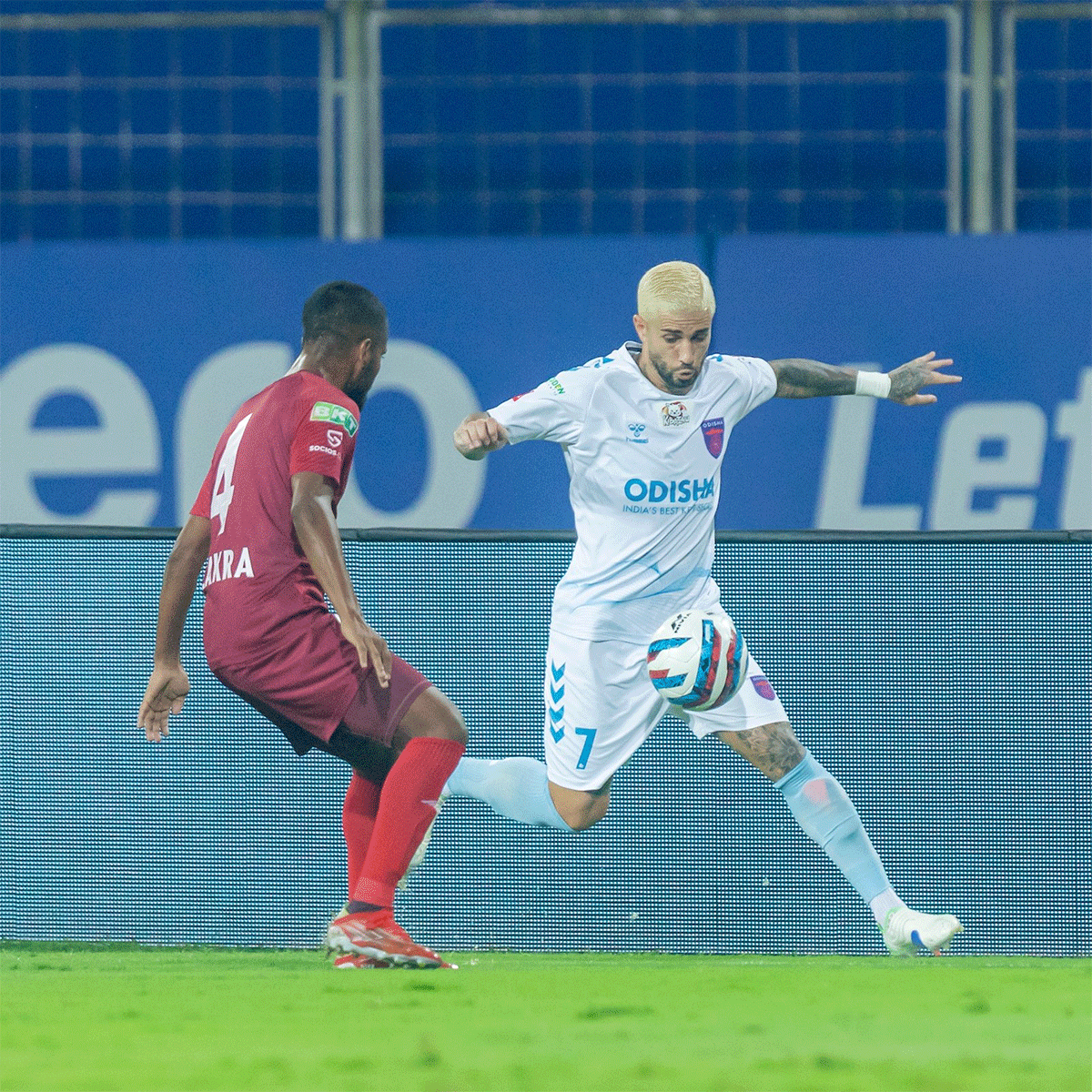 Odisha FC's Aridai Suarez (right) vies for possession during a match against NEUFC in Margao on Tuesday
