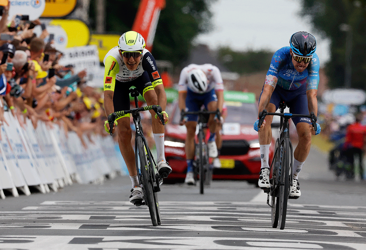 Israel-Premier Tech's Simon Clarke (right) crosses the line to win stage 5 from Lille Metropole to Arenberg Porte du Hainaut, France, on Wednesday 