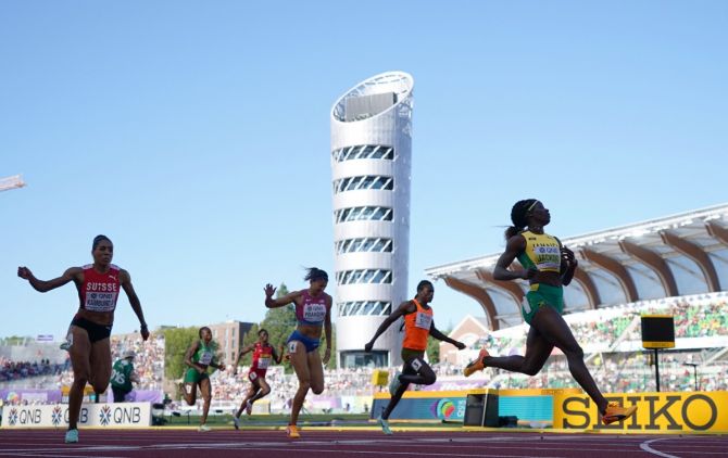 Jamaica's Shericka Jackson crosses the line first in her women's 200 metres semi-final.