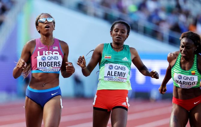 Raevyn Rogers of the United States wins her heat, ahead of second-placed Ethiopia's Habitam Alemu and third-placed Benin's Noelie Yarigo.