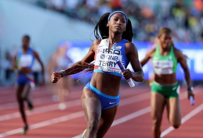 Twanisha Terry wins the women's 4x100 metres relay heat for the United States.