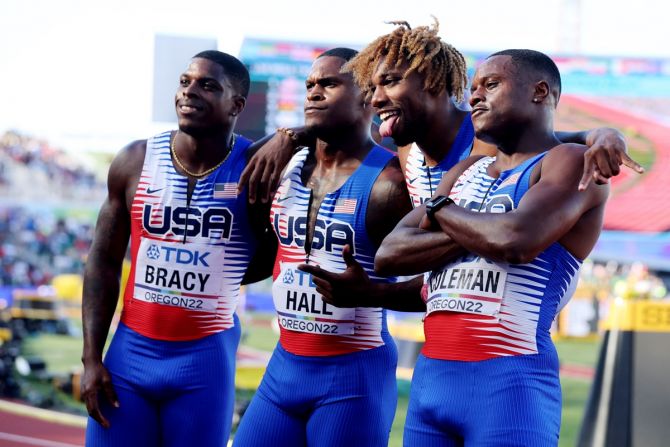 Marvin Bracy, Elijah Hall, Noah Lyles and Christian Coleman of the United States pose after winning their 4x100 relay heat.