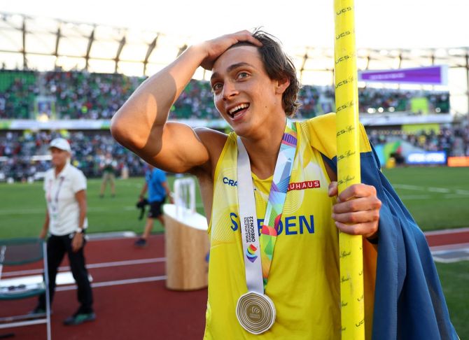 Sweden's Armand Duplantis celebrates winning the men's pole vault final and setting a new World record.