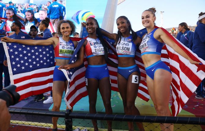 Talitha Diggs, Abby Steiner, Britton Wilson and Sydney McLaughlin of the United States celebrate winning the women's 4x400 metres final.
