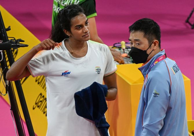 Pusarla Venkata Sindhu in discussion with coach Park Tae-Sang during her mixed team campaign opener against Pakistan's Shahzad Mahoor at the 22nd Commonwealth Games in Birmingham on Friday.