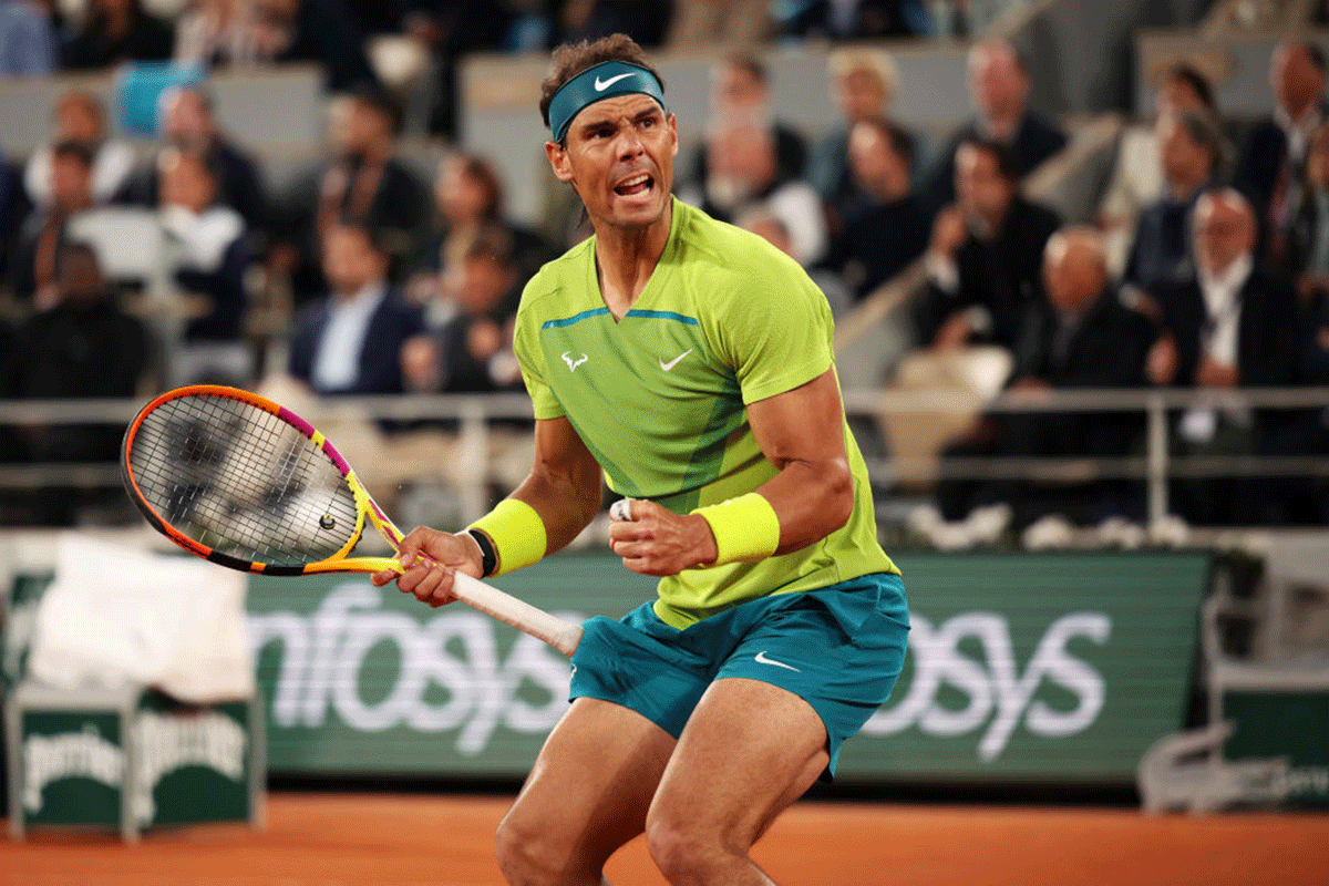 Rafael Nadal celebrates a point against Novak Djokovic during their French Open quarter-final at Roland Garros on Tuesday,