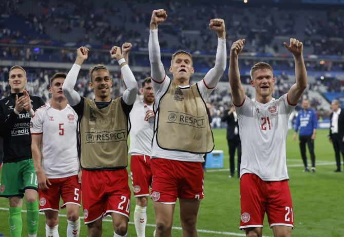 Denmark's Andreas Cornelius and teammates celebrate after victory over France in the UEFA Nations League Group A match at Stade de France, on Friday.