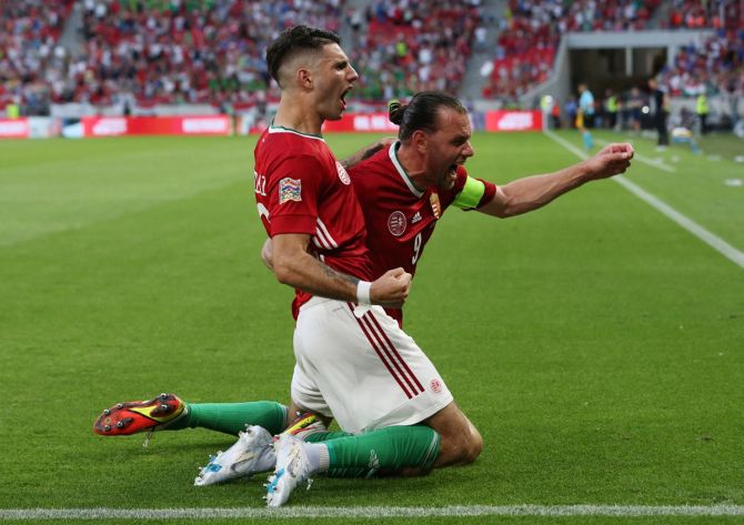 Dominik Szoboszlai celebrates with Adam Szalai after scoring Hungary's goal in the UEFA Nations League Group C match against England at Puskas Arena Park, Budapest, Hungary, on Saturday. Bernadett Szabo/Reuters