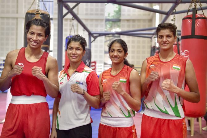 Lovlina Borgohain, Nikhat Zareen, Nitu and Jasmine pose for a photograph after qualifying in the Elite Women's Commonwealth Games Trials 2022, at the Indira Gandhi stadium in New Delhi, Saturday.