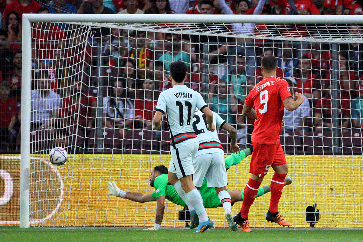 Switzerland's Haris Seferovic scores in the first minute to score the opener and the winner against Portugal in their Group A2 match. 