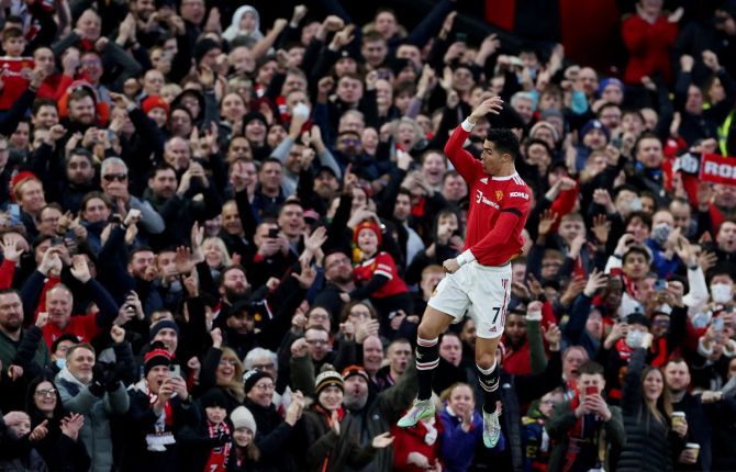 Cristiano Ronaldo celebrates scoring Manchester United's first goal during the Premier League match against Tottenham Hotspur, at Old Trafford, Manchester, on Saturday.