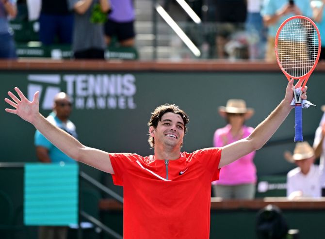 Taylor Fritz celebrates defeating Andrey Rublev in their semi-final.