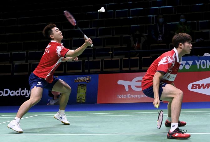 He Ji Ting (L) and Tan Qiang of China in action during their doubles match against Supak Jomkoh and Kittinupong Kedren of Thailand