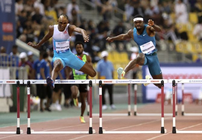 Brazil's Alison dos Santos and Rai Benjamin of the United states during the men's 400m hurdles.