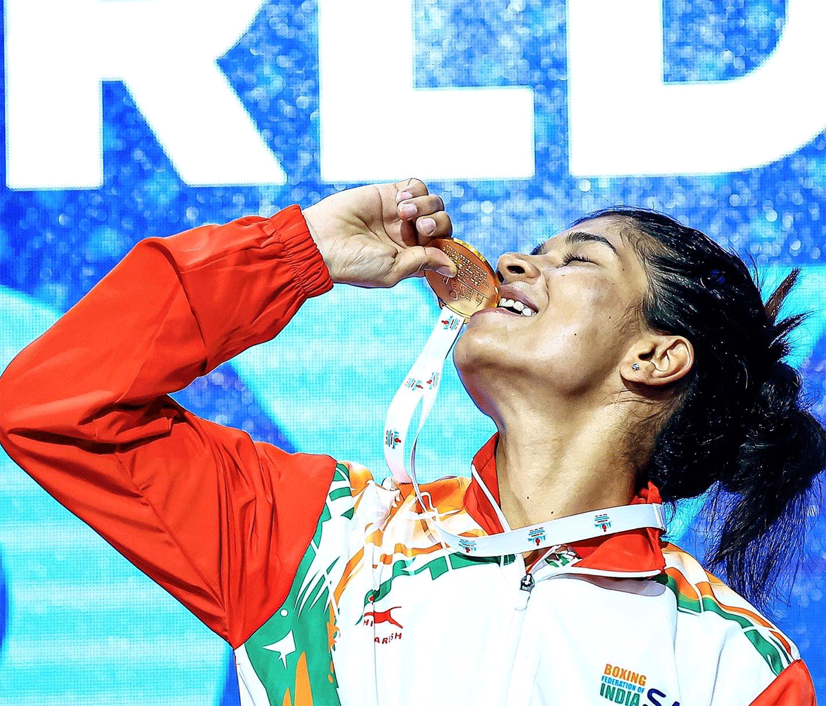 Nikhat Zareen kisses her medal on the podium after winning the Women's Boxing World Championship title in the flyweight category on Friday 