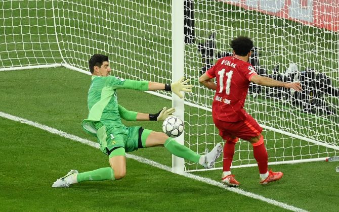 Liverpool's Mohamed Salah is foiled by Real Madrid goalkeeper Thibaut Courtois.