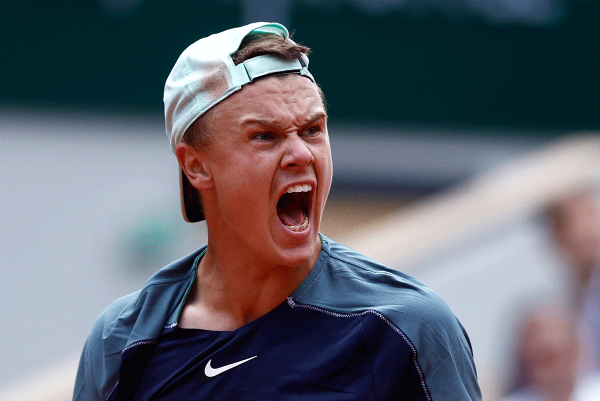 Denmark's Holger Rune reacts during his fourth round match against Greece's Stefanos Tsitsipas 