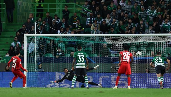 Daichi Kamada scores Eintracht Frankfurt's first goal from the penalty spot during the Champions League Group D match against Sporting Lisbon, at Jose Alvalade Stadium, Lisbon, Portugal.
