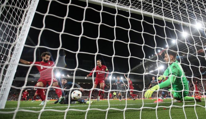 Mohamed Salah scores Liverpool's first goal during the Champions League Group A match against Napoli, at Anfield, Liverpool, on Tuesday.