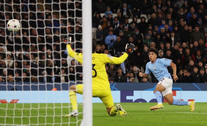 Rico Lewis scores Manchester City's first goal during the Champions League Group G match against Sevilla, at Etihad Stadium, Manchester.