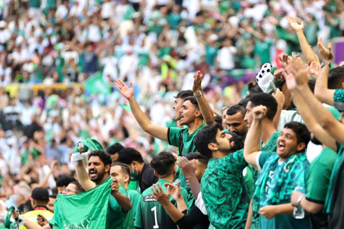 A Saudi Arabia fan celebrates their team's 2-1 victory in the FIFA World Cup Qatar 2022 Group C match between Argentina and Saudi Arabia at Lusail Stadium.