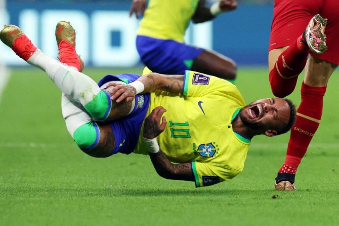 Brazil's Neymar reacts after a challenge from Serbia's Sasa Lukic